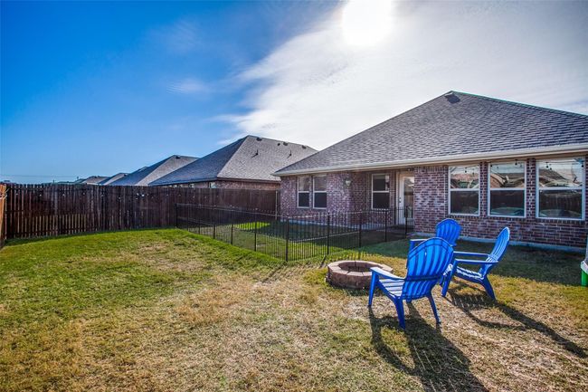 View of yard with an outdoor fire pit | Image 22