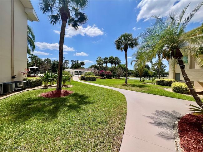 View of property's community with a lawn | Image 28