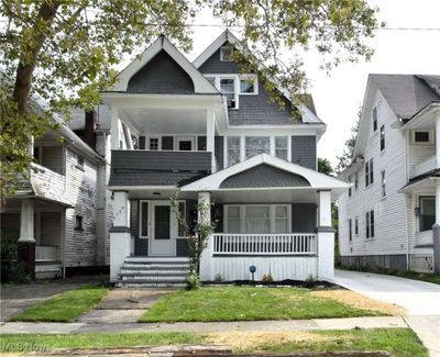 View of front facade with covered porch and a balcony | Image 1