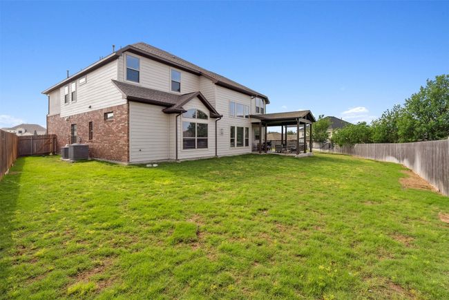 The spacious backyard offers endless possibilities, from creating a garden oasis to adding a pool or outdoor living area. With plenty of room to stretch out and enjoy, it's the perfect setting to customize and make your own | Image 36