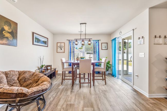 Dining room with light wood-style floors and baseboards | Image 17
