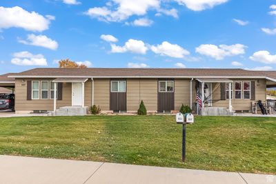 Ranch-style home with a front lawn | Image 3