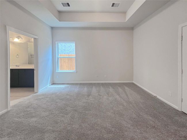 Owner's Suite with Tray Ceiling. Home under construction. Sample floor plan photo used for illustrative purposes only. Upgrades, selections options, windows and colors may vary. | Image 8