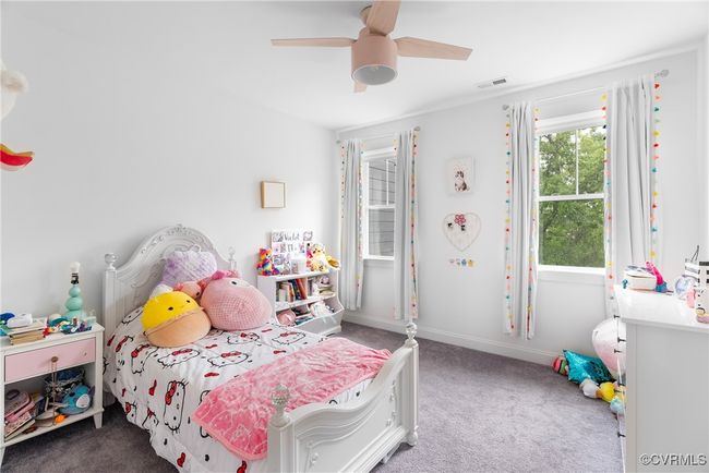 Bedroom featuring carpet, ceiling fan, and baseboards | Image 31