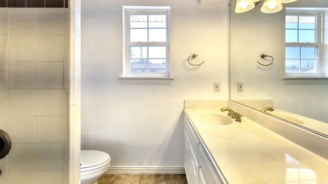 Bathroom featuring vanity, a healthy amount of sunlight, and toilet | Image 27