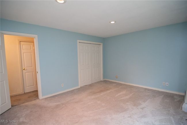 Unfurnished bedroom featuring carpet floors, a closet, recessed lighting, and baseboards | Image 17