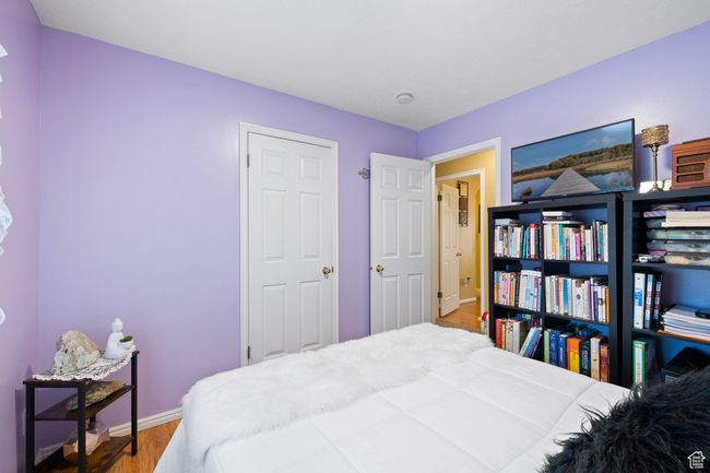 Bedroom featuring wood-type flooring | Image 23