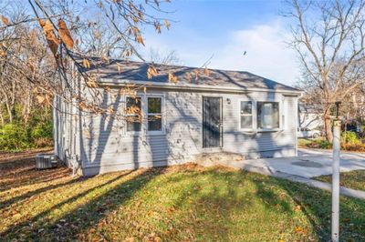 View of front of home with central air condition unit and a front yard | Image 2