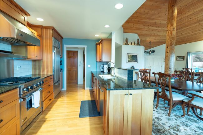 Kitchen and dining room taken from the kitchen eating nook. Note the Viking gas range and Sub Zero refrigerator | Image 24