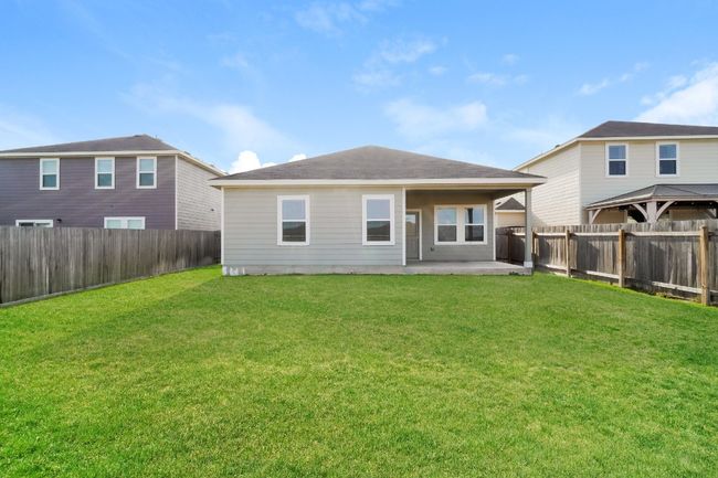 Rear view of house featuring a patio area, a fenced backyard, and a gazebo | Image 25
