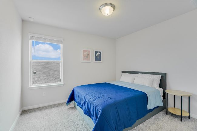 Carpeted bedroom with baseboards | Image 22