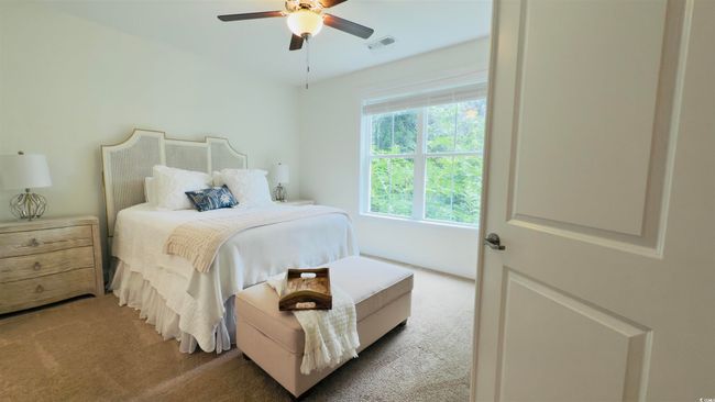 Bedroom featuring carpet floors and a ceiling fan | Image 25