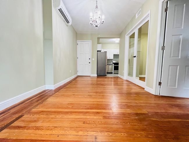 Opposite view of the living room, looking into the kitchen. | Image 5