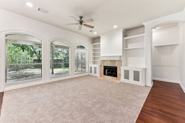 Gorgeous family room with beautiful windows, gas fireplace, built-ins and speaker cabinets | Image 22