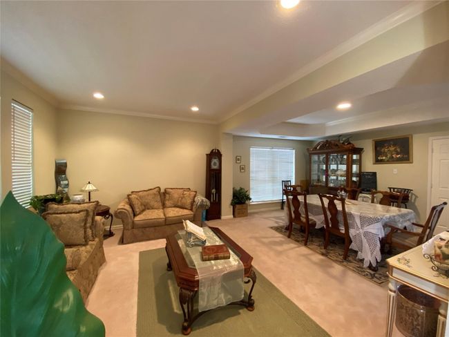 Carpeted living room featuring ornamental molding | Image 14