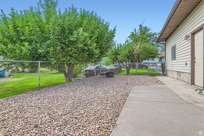 View of yard featuring a gate | Image 29