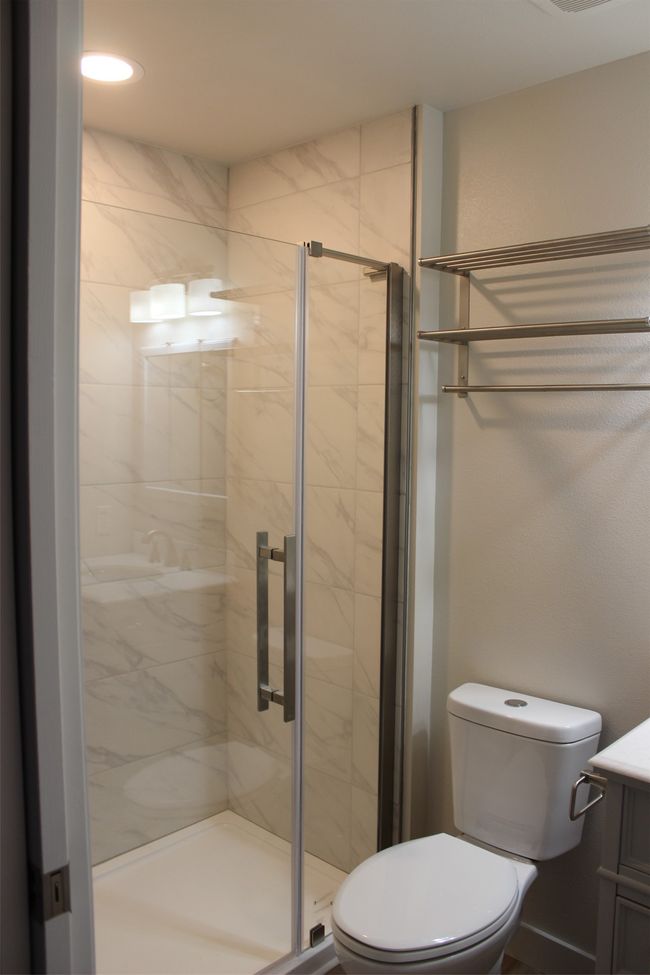 Full bathroom featuring vanity and a shower stall | Image 18
