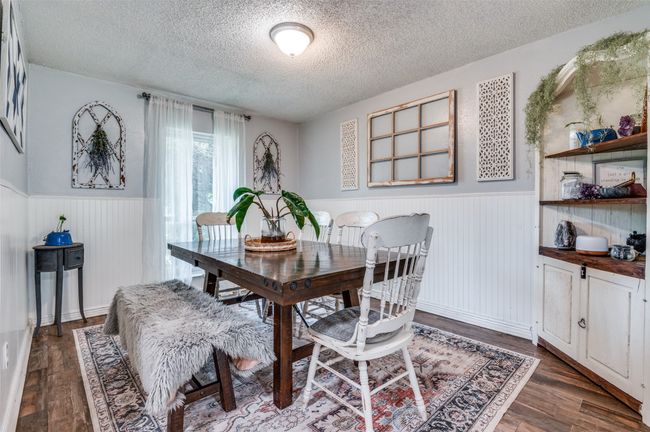 Dining room with a wainscoted wall | Image 13