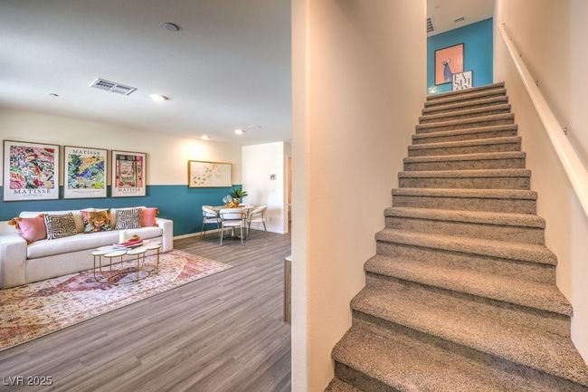 Stairway with baseboards, visible vents, and wood finished floors | Image 19