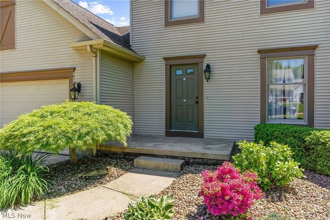 Doorway to property with a garage | Image 4