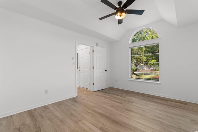Unfurnished dining area with a chandelier, light wood-type flooring, and baseboards | Image 12