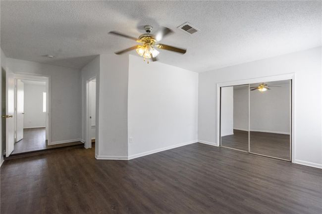 Laundry / utility room located to the right off the bonus room and across the hall from the primary bedroom. | Image 16