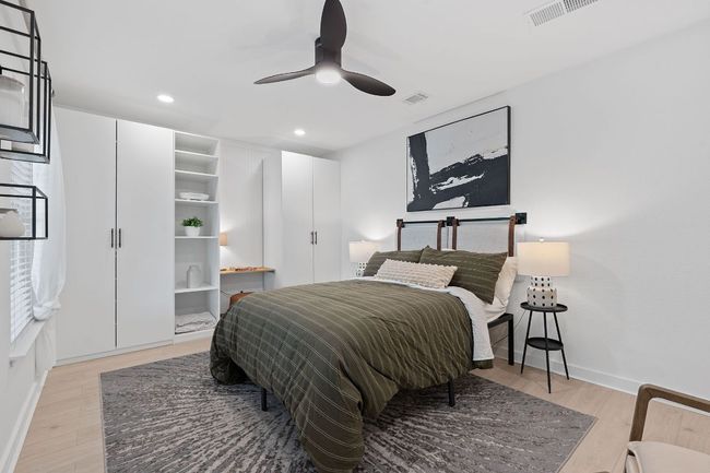 Bedroom with light wood-style flooring, recessed lighting, and ceiling fan | Image 27