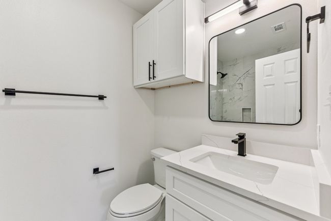 Full bath featuring vanity and a marble finish shower | Image 27
