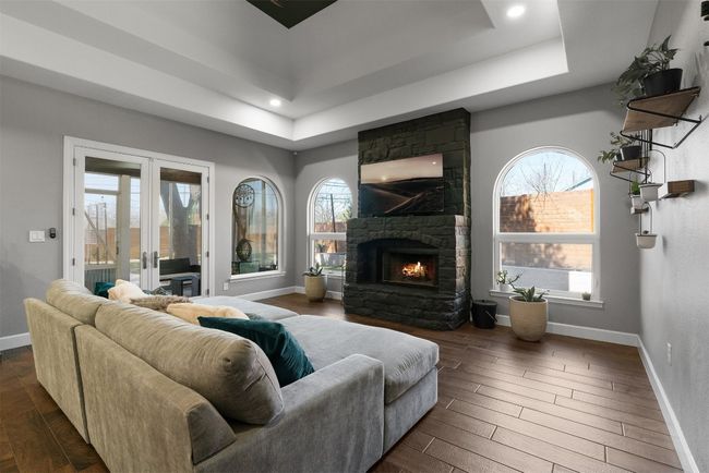 With direct access to the screened-in patio, the living room transforms into an entertainer’s dream, providing seamless flow from indoor to outdoor living | Image 21