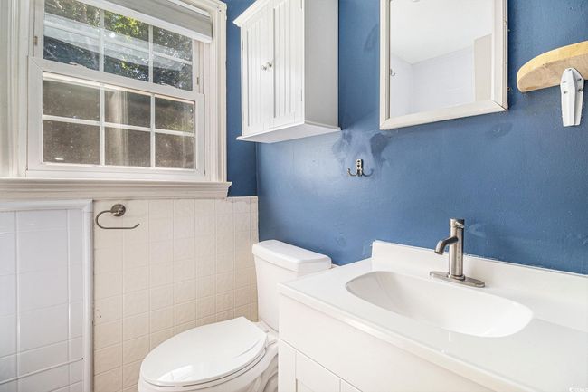 Bathroom featuring vanity and tile walls | Image 13