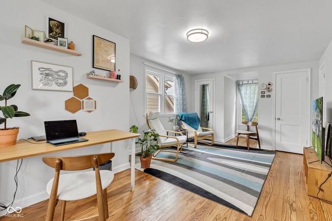 Upper floor large second bedroom with room to relax, create, sleep, work, vibe. Double additional closets flanking the front window. | Image 36