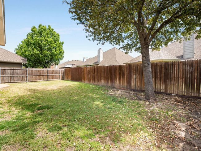 View of fenced backyard | Image 37