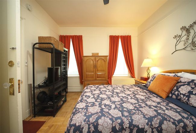 Bedroom featuring radiator heating unit | Image 15