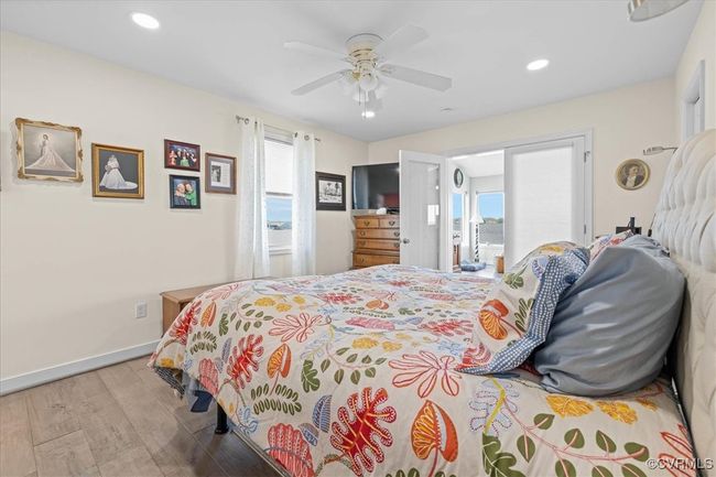 Another view of the primary bedroom on 1st floor looking into family/great room with river views! | Image 19