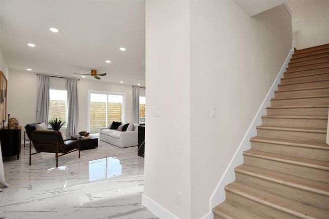 The home is flooded with natural sunlight. Welcome to your bright, open floor plan with high ceilings. | Image 6