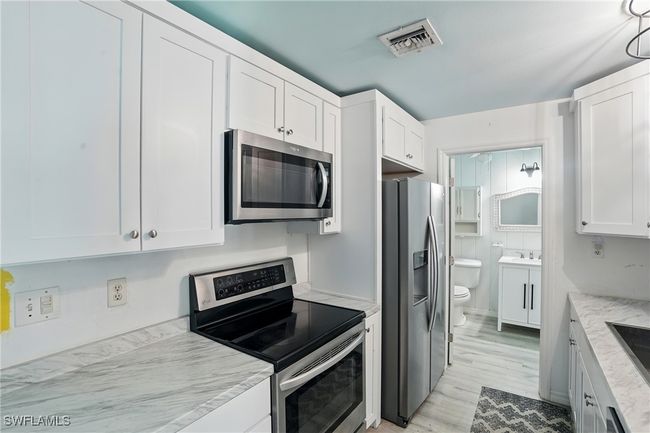 4011 Coconut Cir S, House other with 2 bedrooms, 2 bathrooms and null parking in NAPLES FL | Image 8