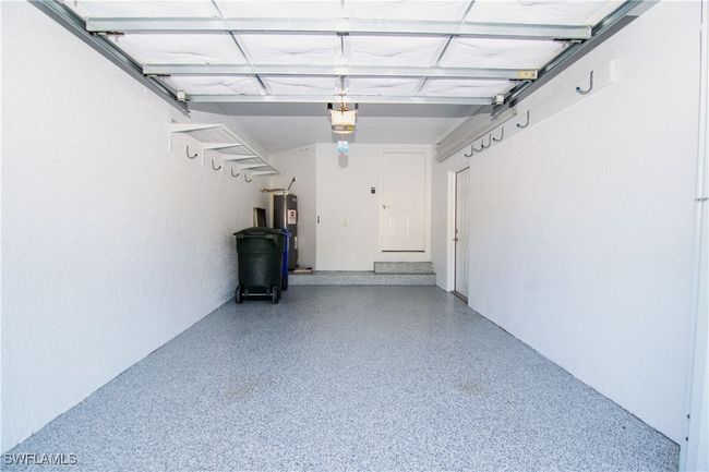 Clean, neat and freshly painted garage with epoxy floor painting. | Image 25