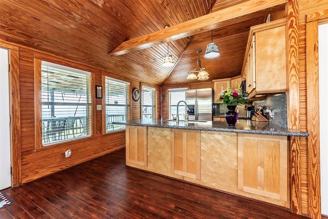 Open concept kitchen with room for barstools | Image 11