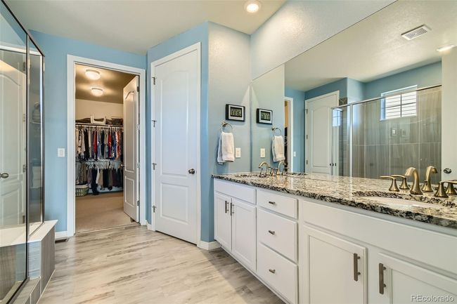 Primary bathroom attached to a capacious walk-in closet 11.7 x 11.1. | Image 9