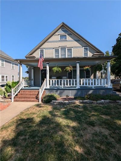 View of front of home featuring covered porch and a front lawn | Image 3