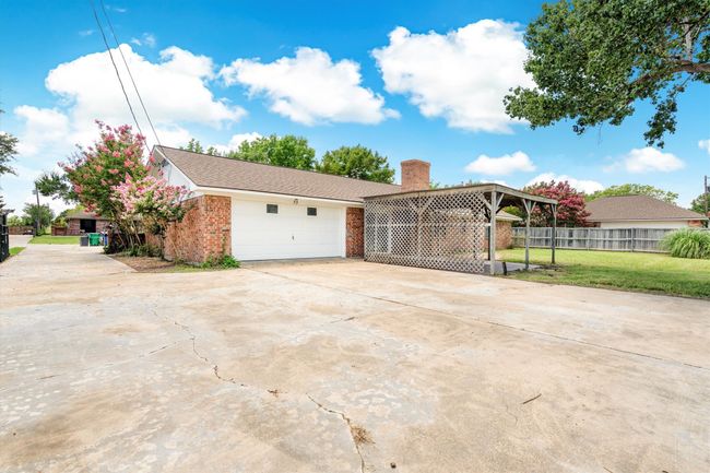Extra parking space in back. private gated entrance to back | Image 30