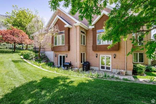 Back of house featuring brick siding | Image 83