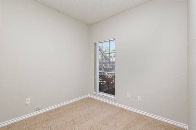Carpeted spare room with baseboards and a textured ceiling | Image 9