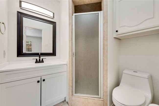 Bathroom with vanity and a stall shower | Image 15