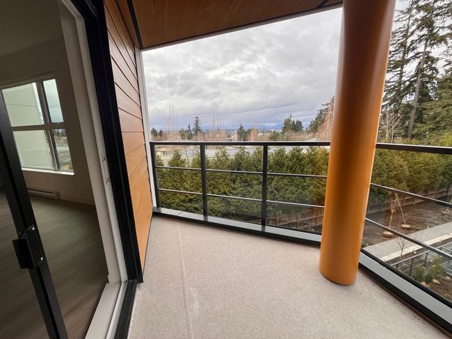 Balcony featuring a baseboard radiator | Image 5