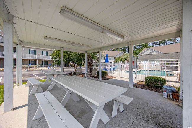 View of patio / terrace with a community pool and outdoor dining space | Image 30