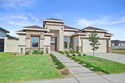 Prairie-style house with a front lawn | Image 1