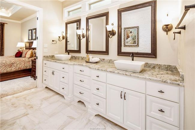 Ensuite bathroom featuring ensuite bathroom, a sink, double vanity, and ornamental molding | Image 17