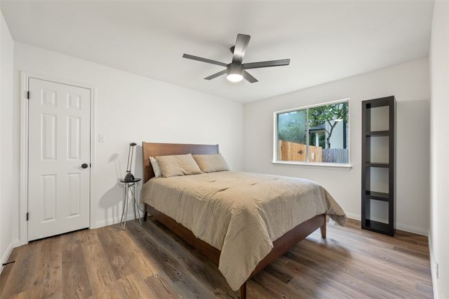 Bedroom with wood finished floors and ceiling fan | Image 30