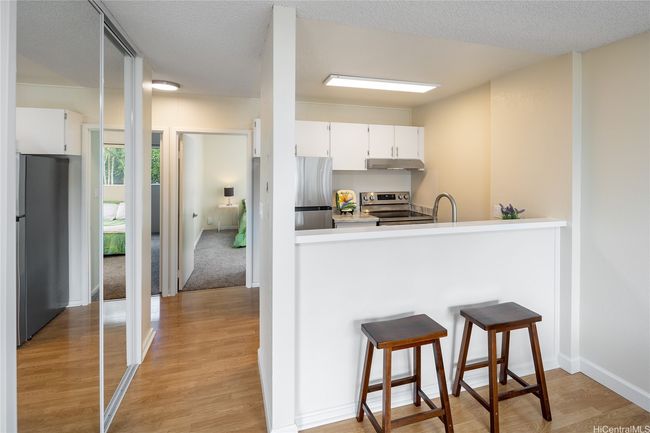 Kitchen with new appliances and the pantry has new mirrored doors. | Image 6
